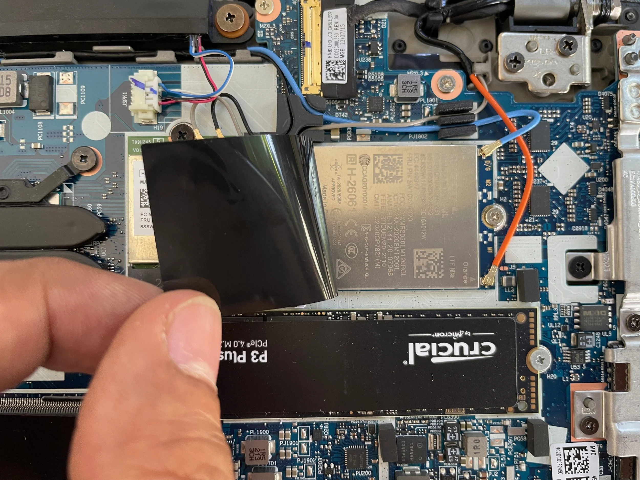 Replace the old SSD with new one, and put the WWAN card in place and antenna cable too